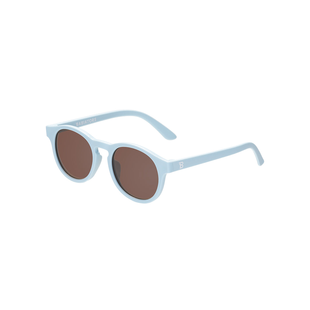 Light blue sunglasses with brown lenses on a white background