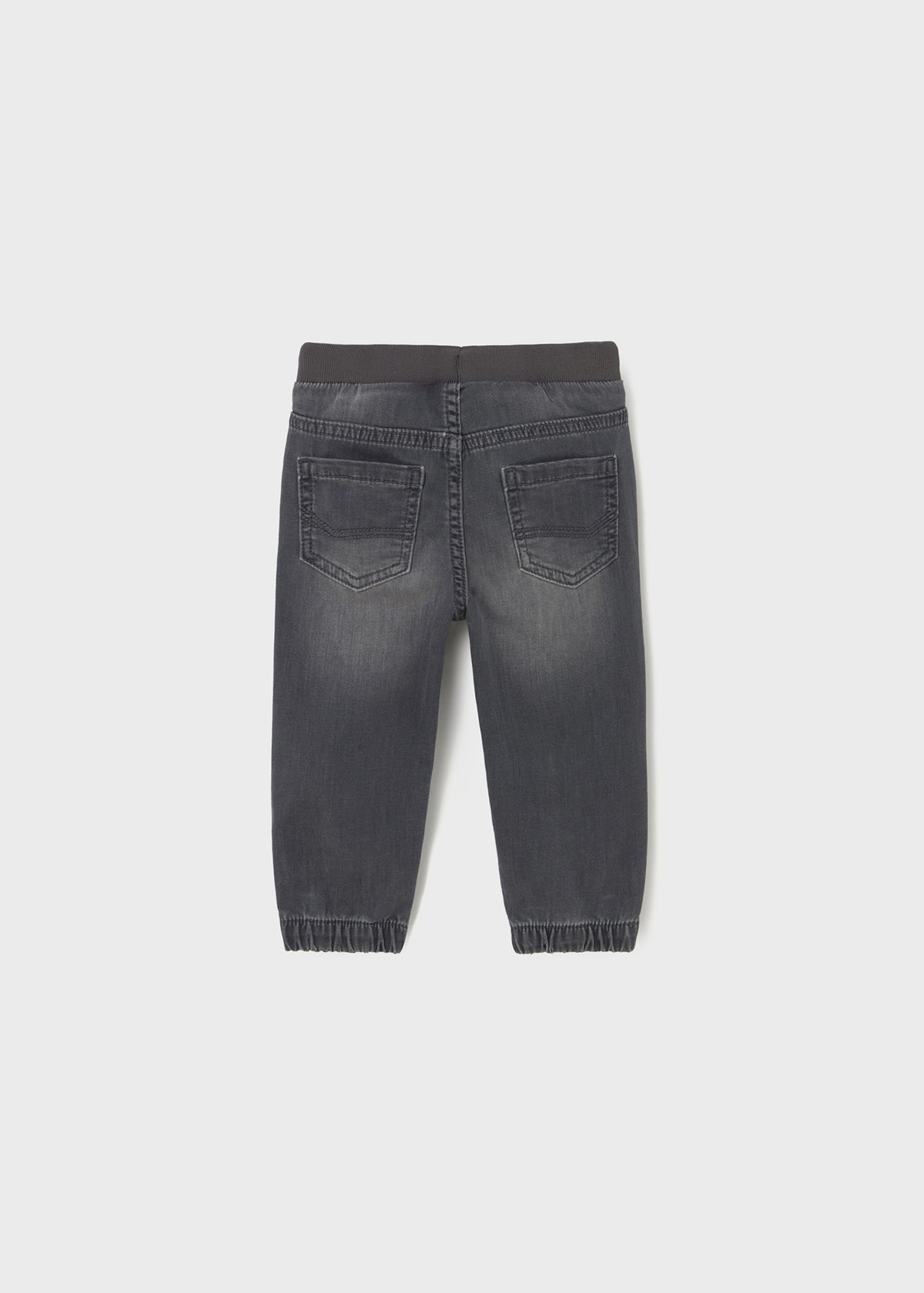 Back view of a gray denim jogger on a white background