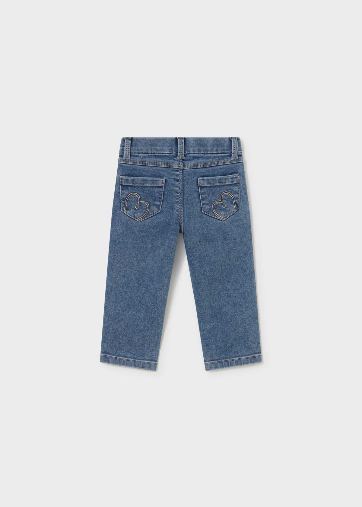 A pair of blue denim jeans shown from the back, featuring embroidered monogram details on the back pockets, displayed against a light gray background.