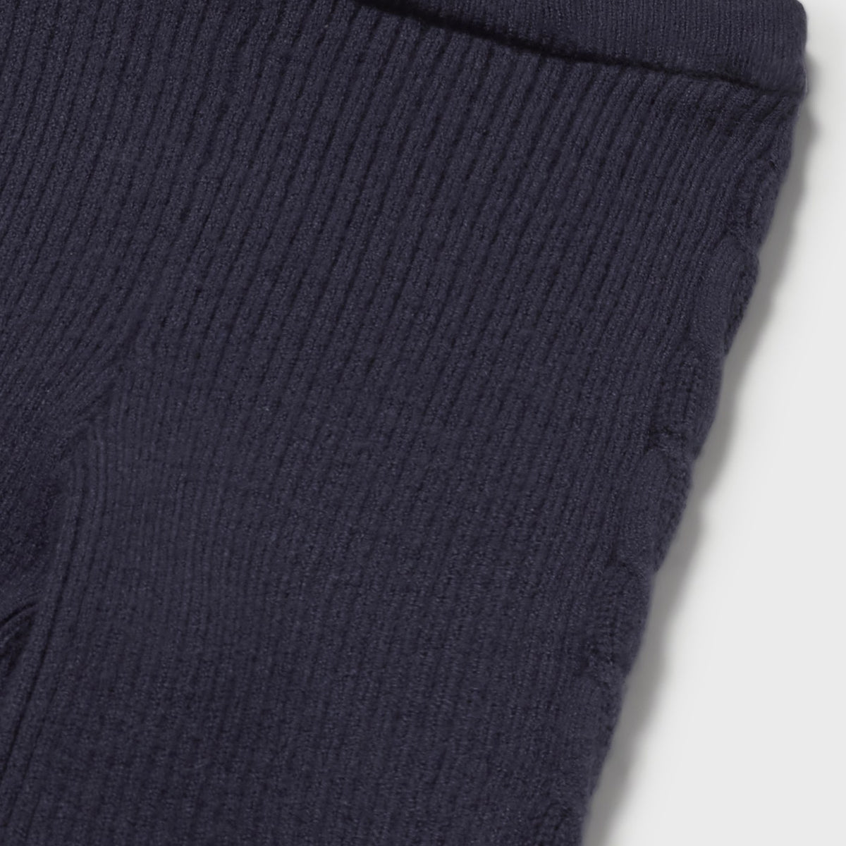 Navy ribbed knit fabric on a white background