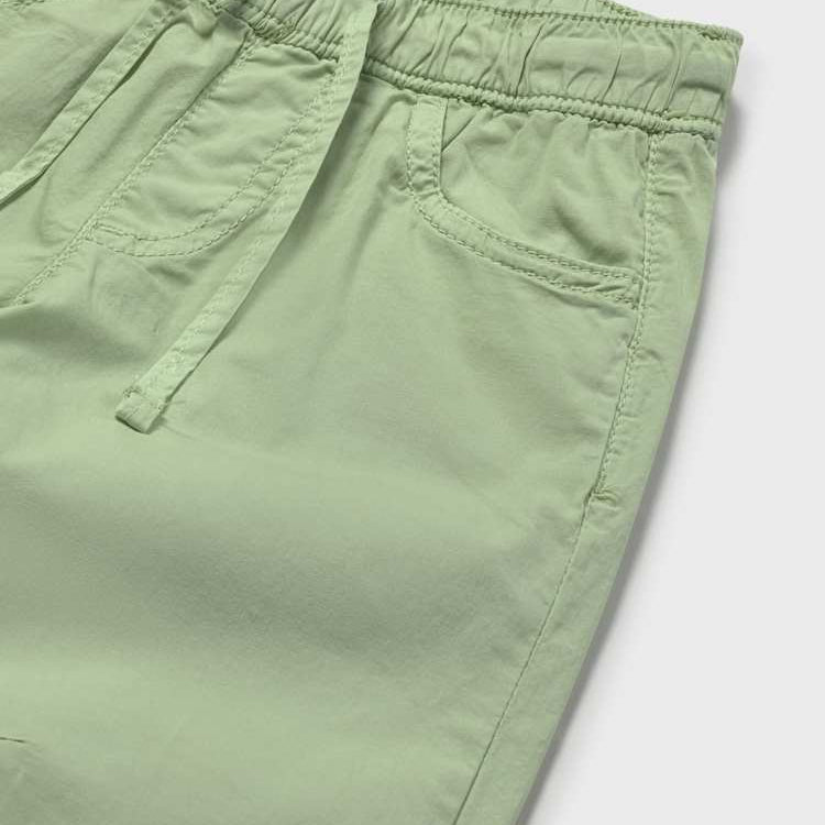 Close-up of green shorts on a white background