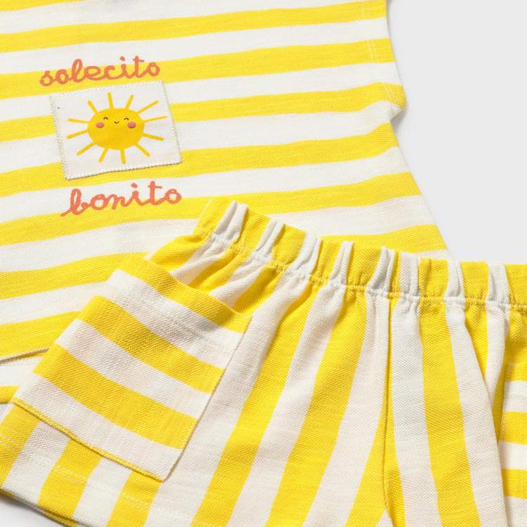 Yellow and white striped outfit with a sun design on a white background