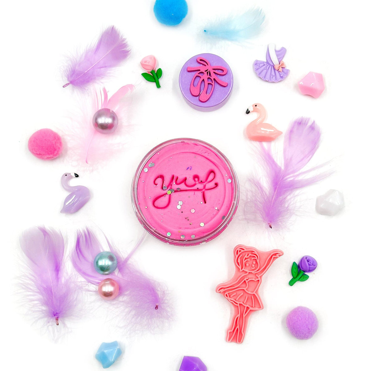 Colorful cat toys with 'Yup' branding on a white background