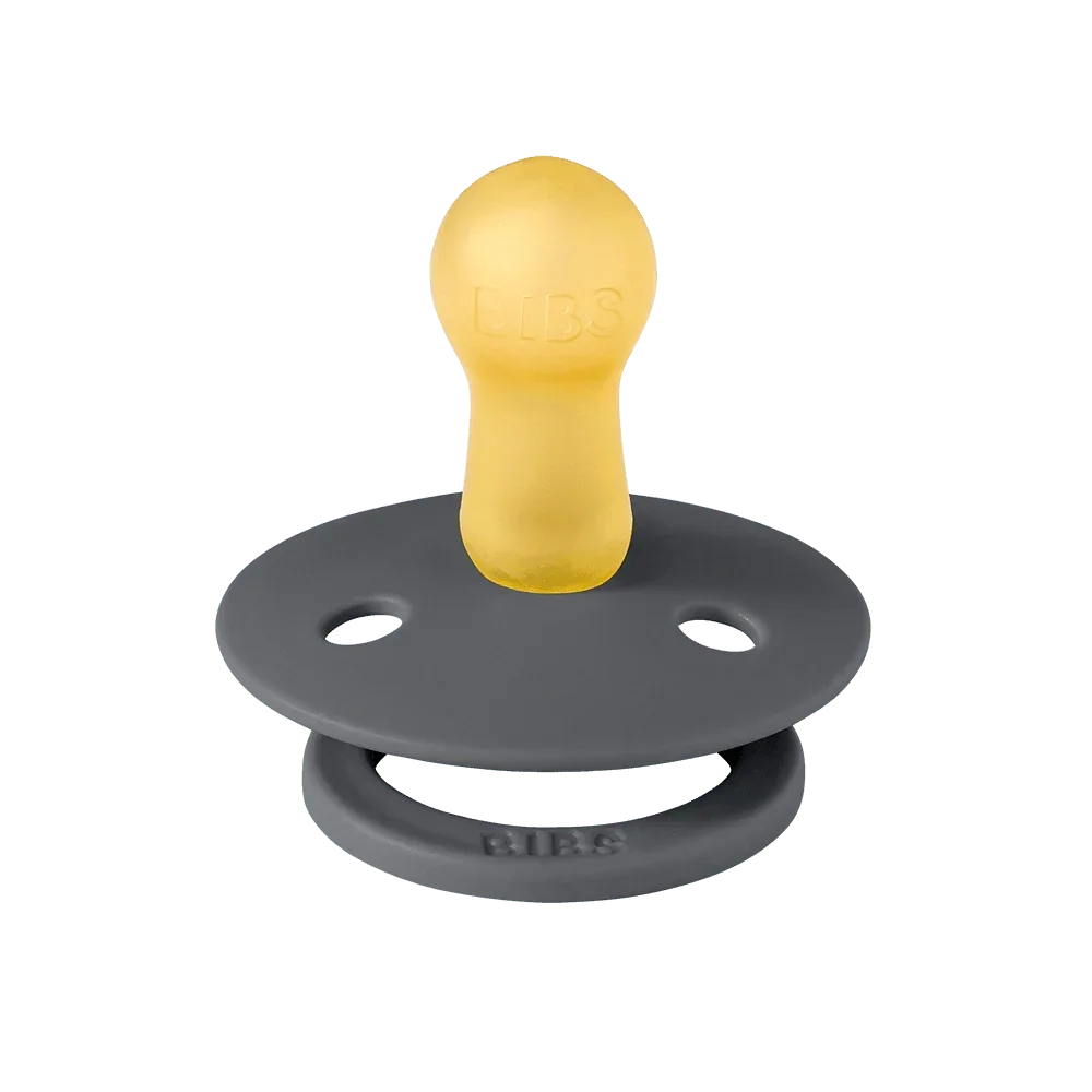 Gray and yellow pacifier on a white background