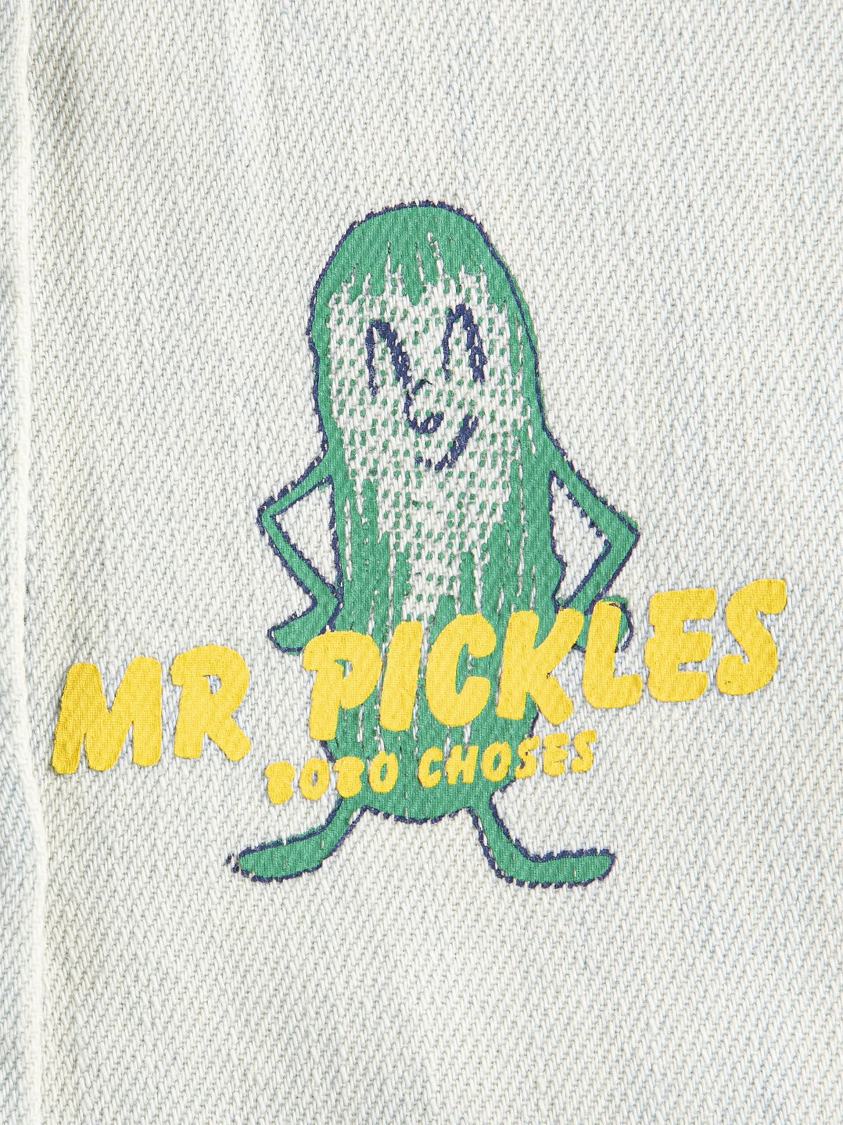 Embroidered design of a pickle with text on a light gray background