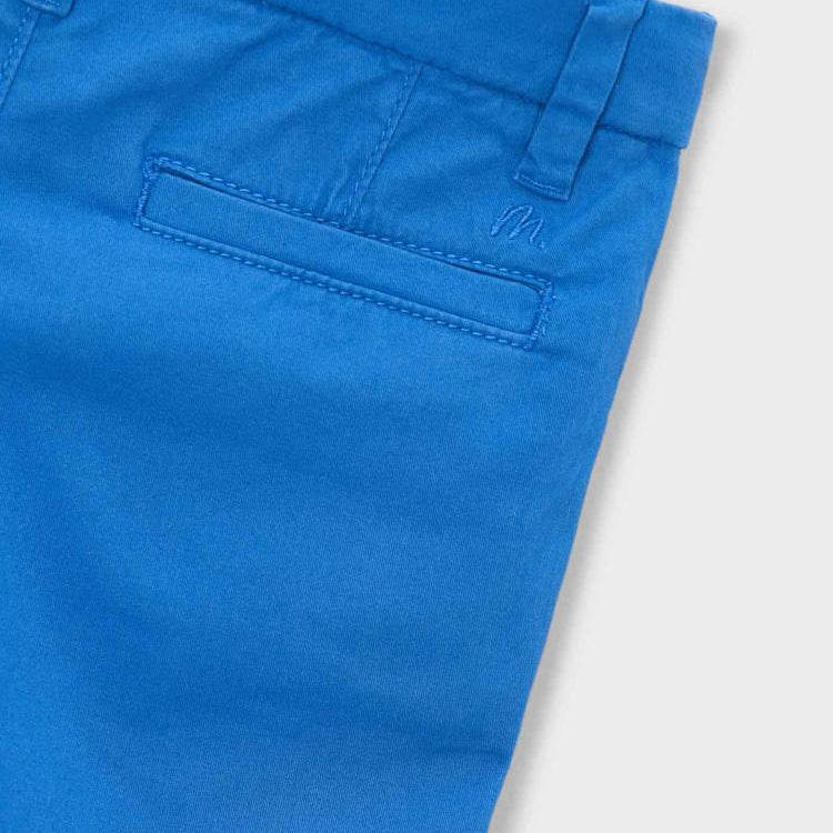 Close-up of blue pants on a white background