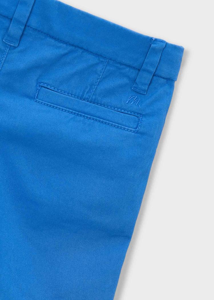 Close-up of blue pants on a white background