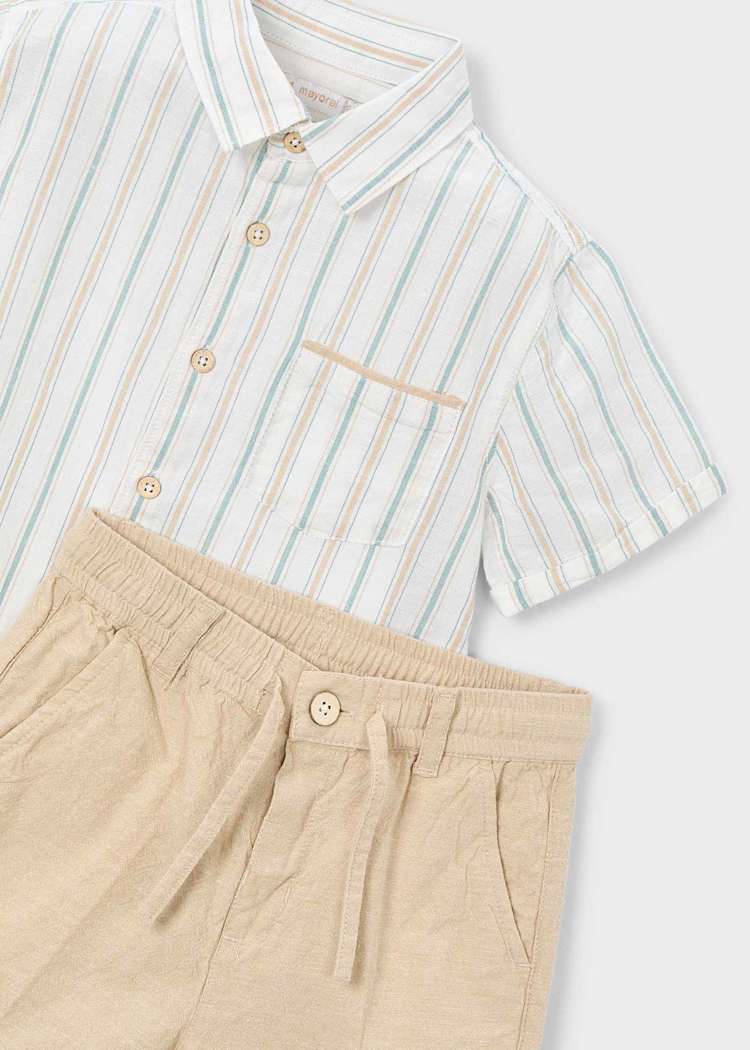 Striped shirt and beige pants on a white background