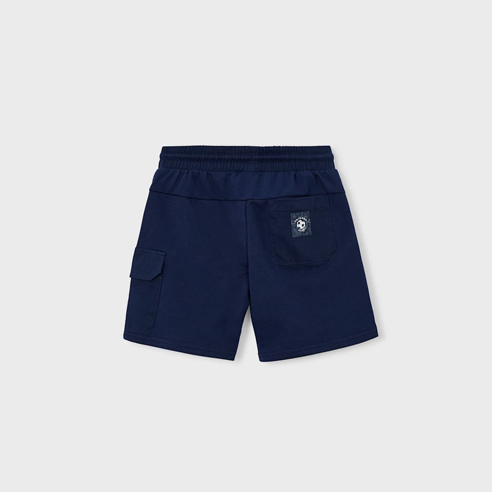 Navy blue shorts on a light gray background