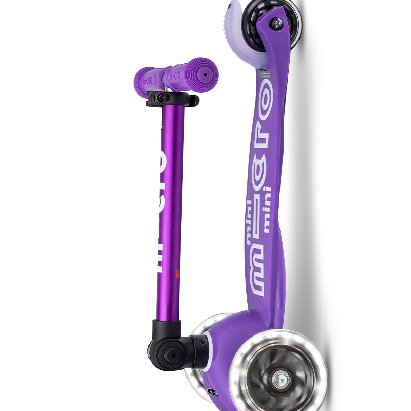 Purple scooter with black accents on a white background