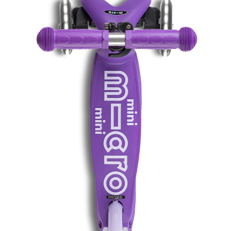 Purple scooter with 'micro' branding on a white background
