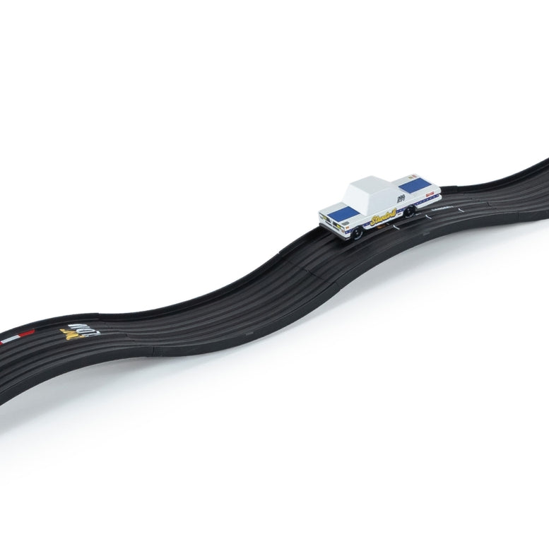Model of a race car on a track with a white background