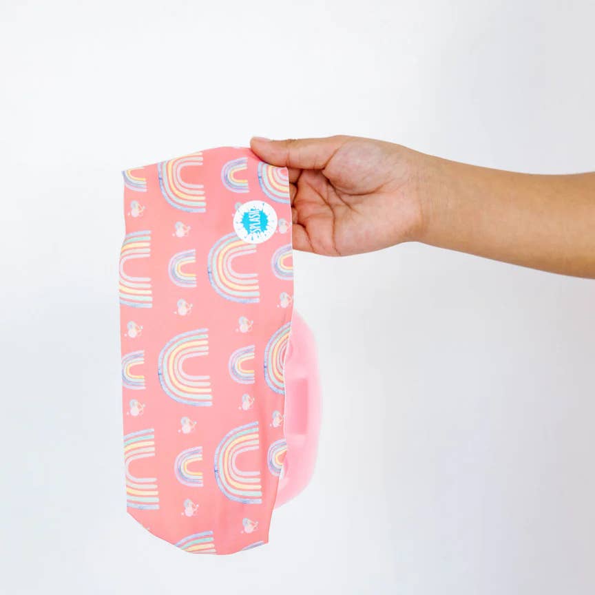 Pink pouch with rainbow pattern held by a hand against a white background