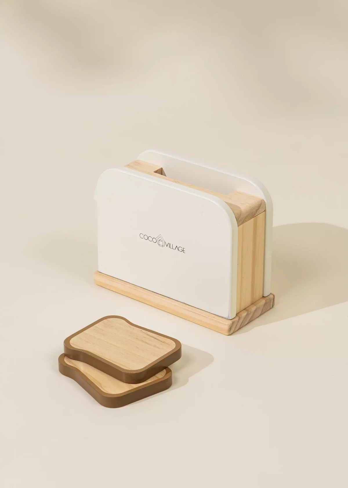 Wooden toaster with white interior on a beige background