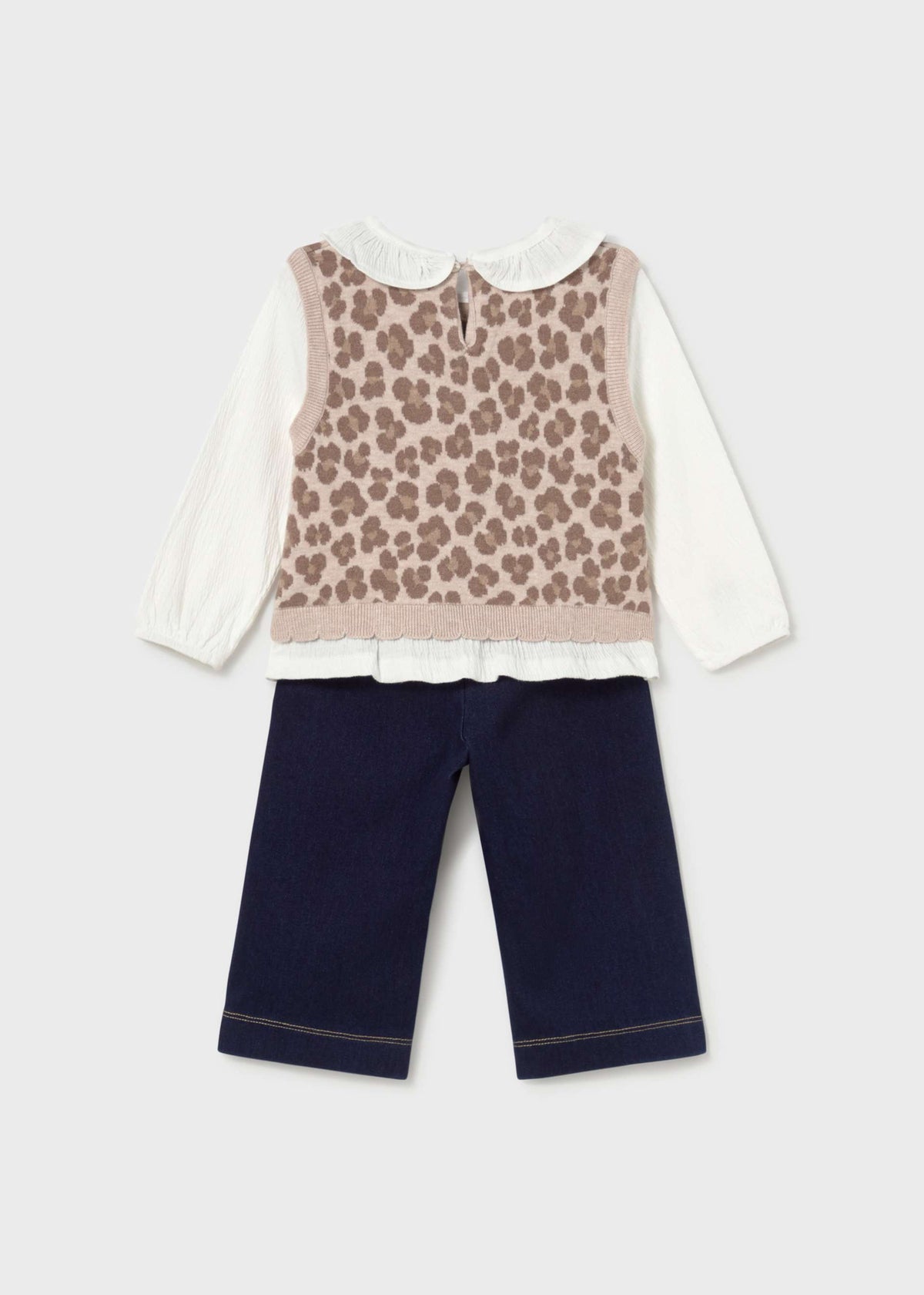 A toddler girl's two-piece outfit set featuring a white long-sleeve blouse under a beige leopard-print knit vest, paired with navy blue pants, shown against a light gray background.