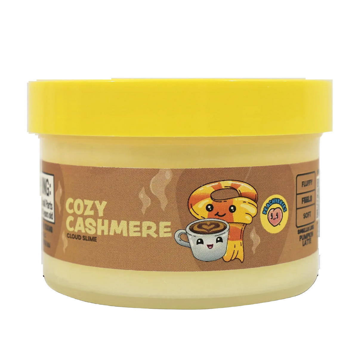 A jar of Cozy Cashmere Cloud Slime party makeup by NECA, featuring a bright yellow lid and a brown label with a cartoon character holding a coffee cup.