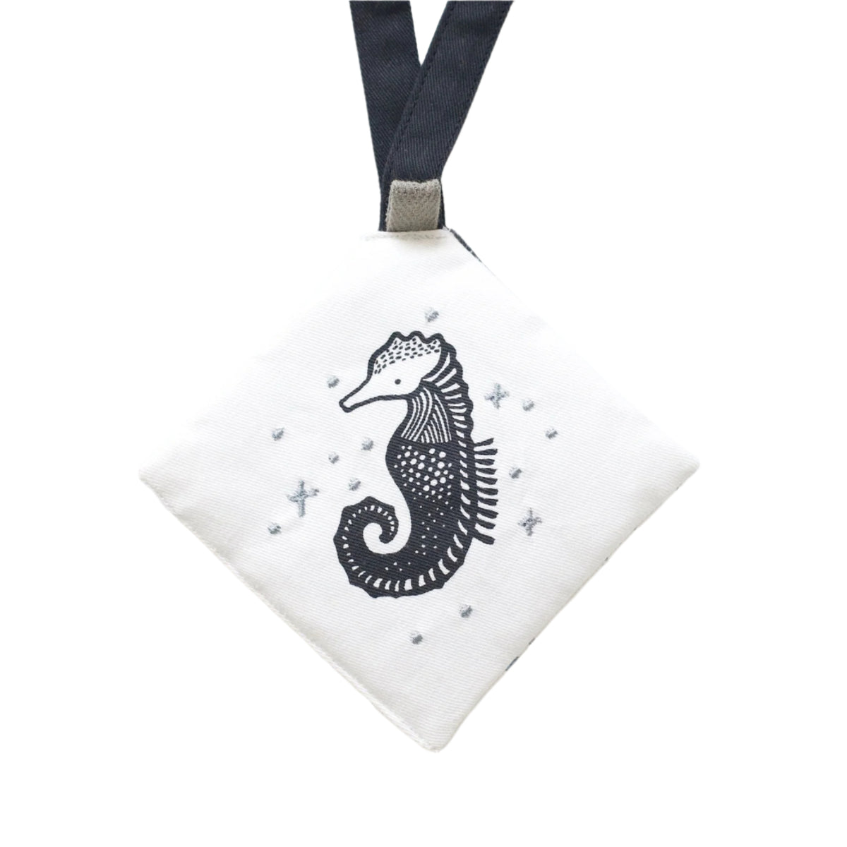 White pouch with a black seahorse design and a strap on a white background