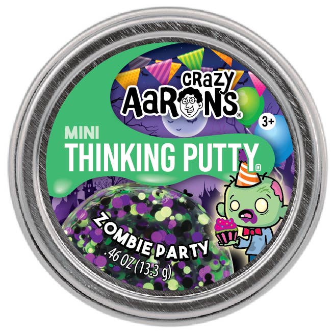 A round metal tin of Crazy Aaron's Mini Thinking Putty in the Zombie Party flavor, featuring a colorful label with a green background, purple glittery putty inside, and cartoon graphics of a zombie and party hats.