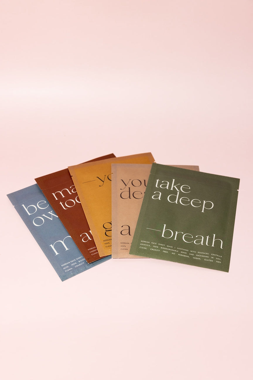 Five packets of a product with motivational text on a gradient background