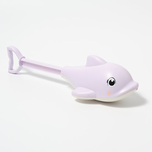 White sand shovel with dolphin design on a white background