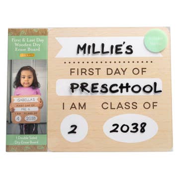 Wooden sign with 'Millie's First Day of Preschool' text and a photo of a child holding a sign.