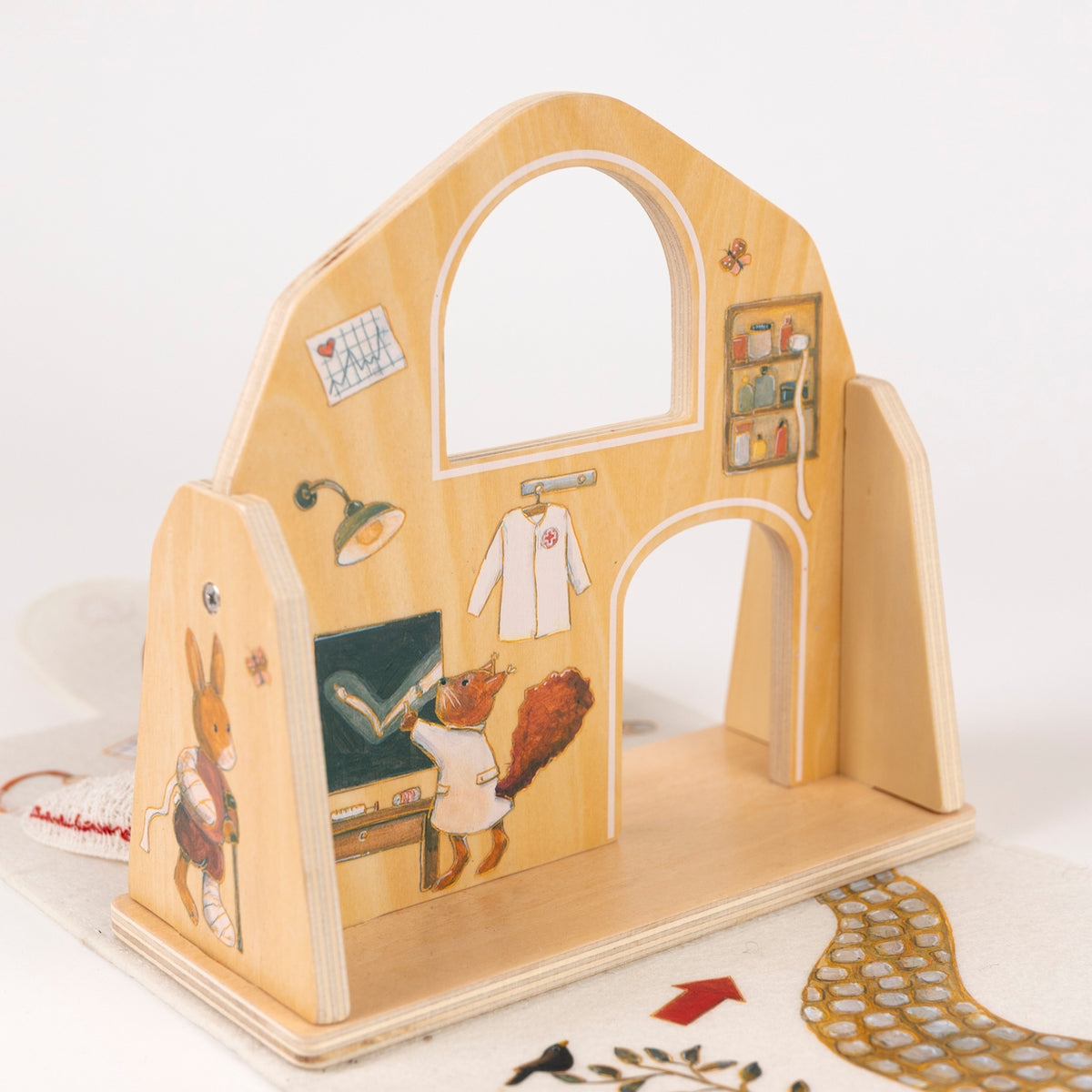 Wooden playhouse with animal illustrations on a white background