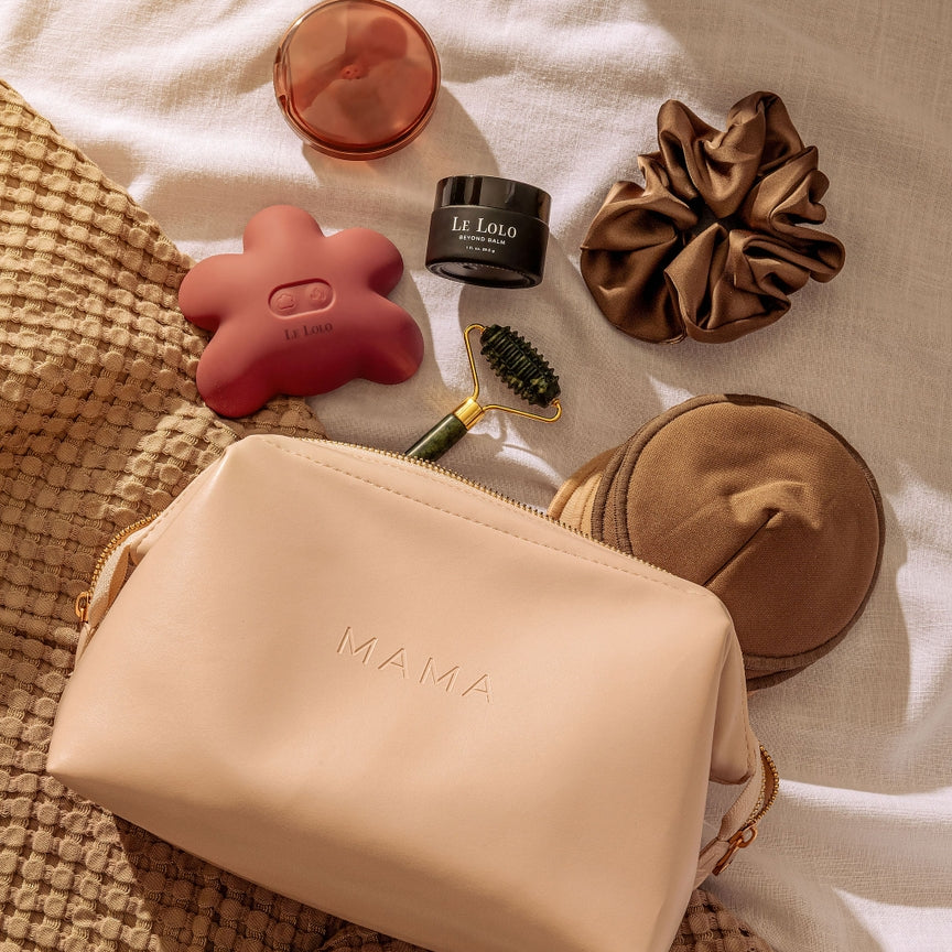 Cosmetic bag with skincare products on a textured surface