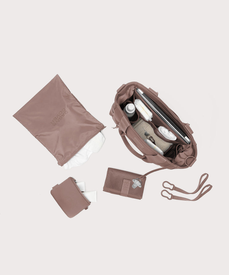 Set of brown bags and accessories on a light gray background