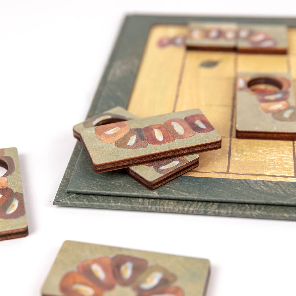 Wooden game pieces with a checkered board on a white background