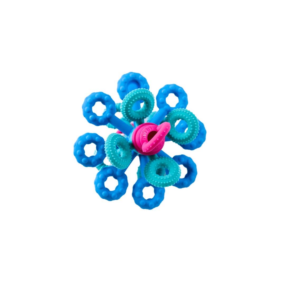 Colorful flower-shaped toy with blue, green, and pink loops on a white background