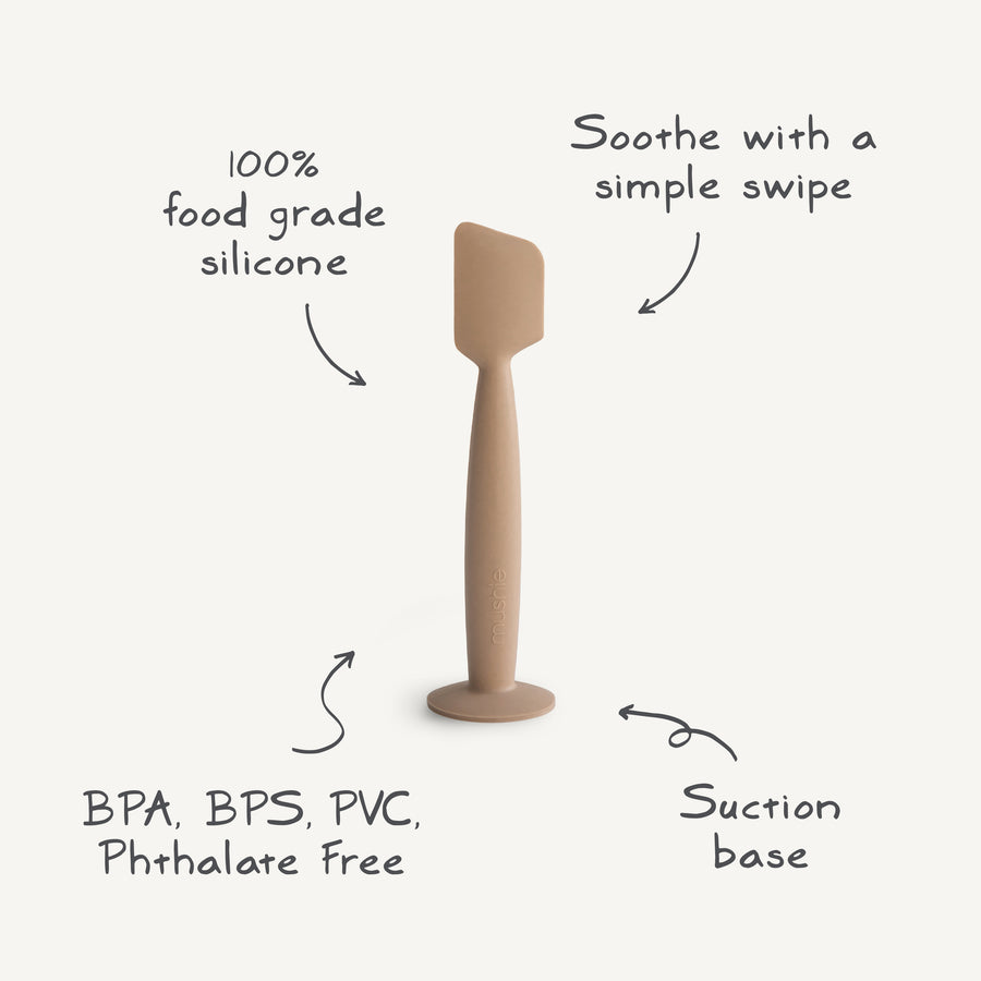 Silicone spatula with text highlighting features on a white background