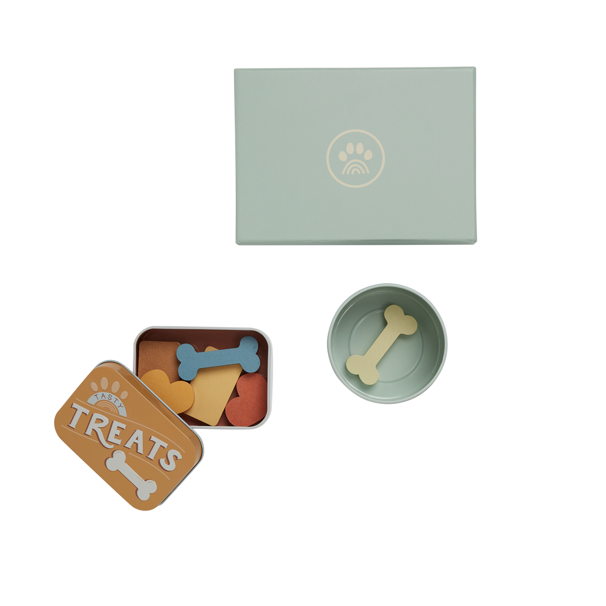 Pet toy set with a small bowl, treat container, and bone-shaped toys on a white background.
