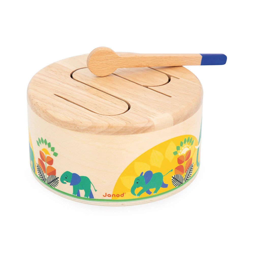 Wooden toy drum with animal design and wooden mallet on a white background