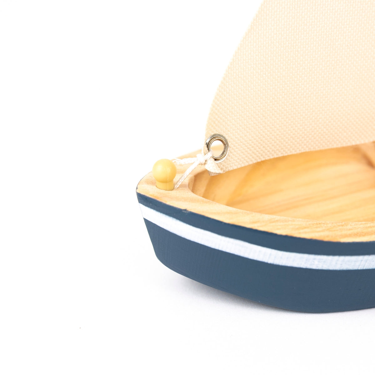 Small model boat close up on a white background