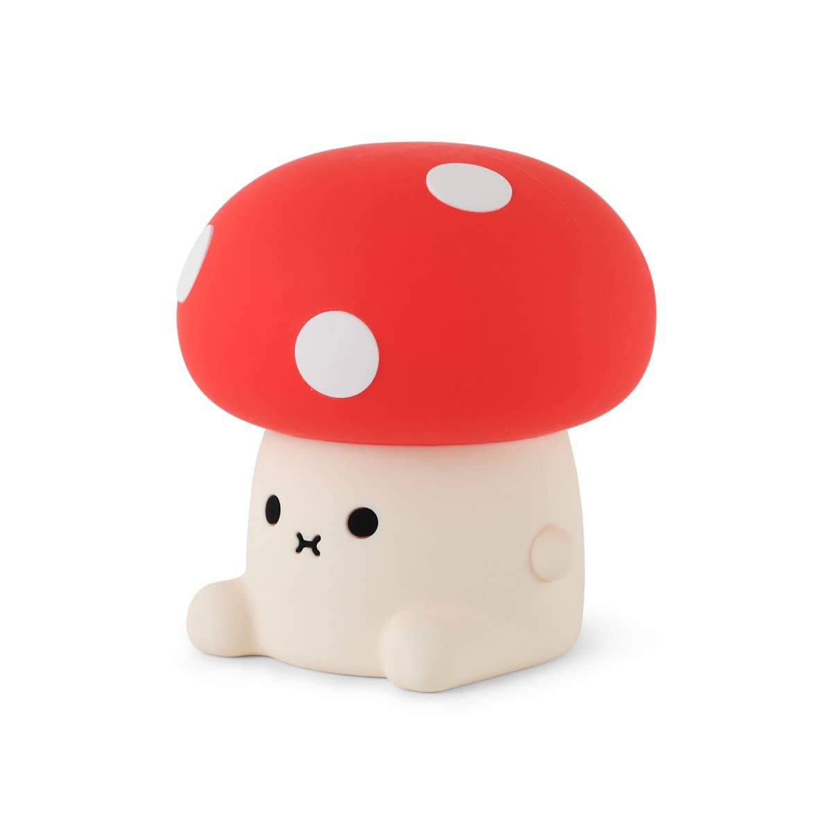 Cute mushroom-shaped toy with a red cap and white spots on a white background