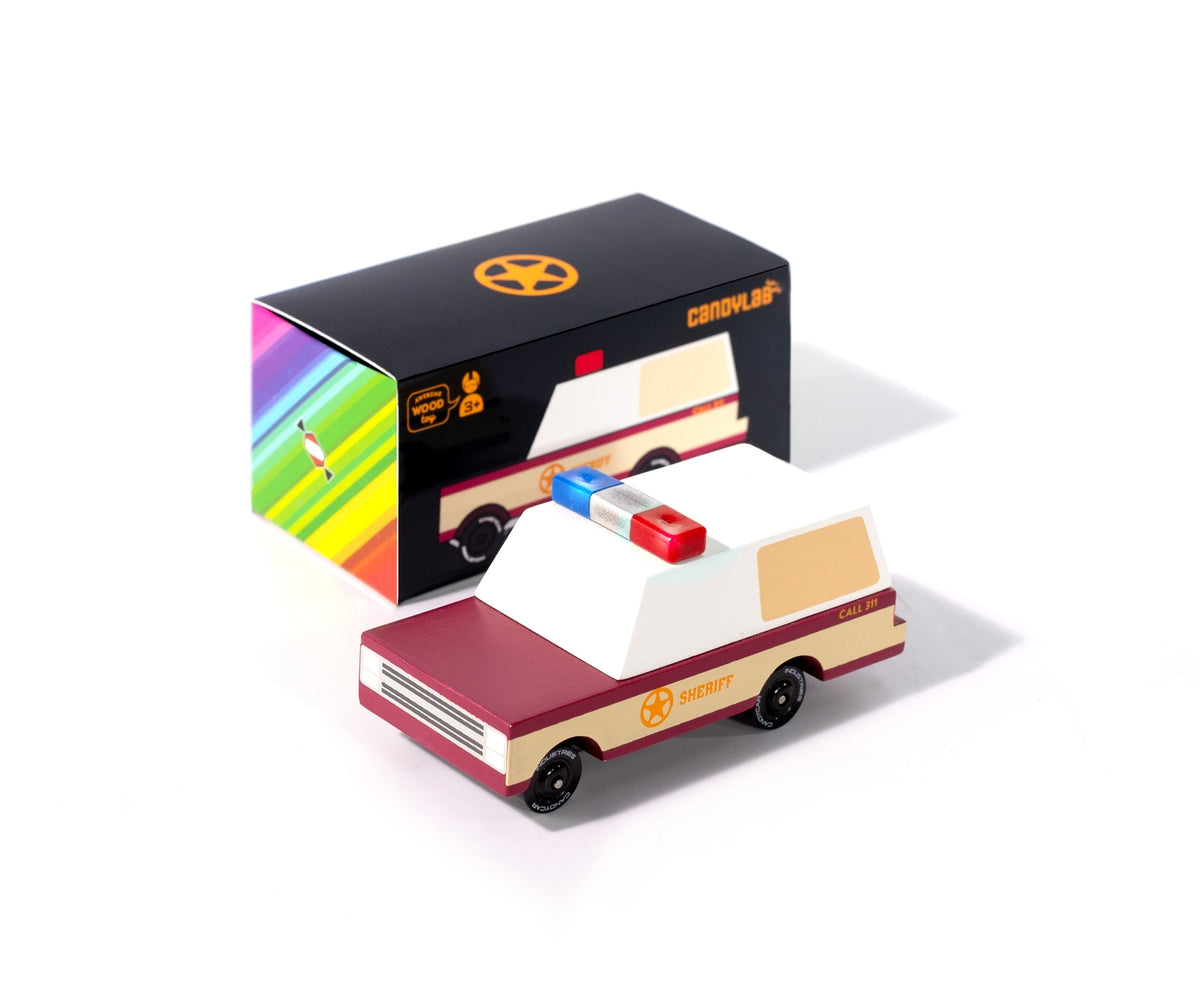 Toy van with a colorful box on a white background
