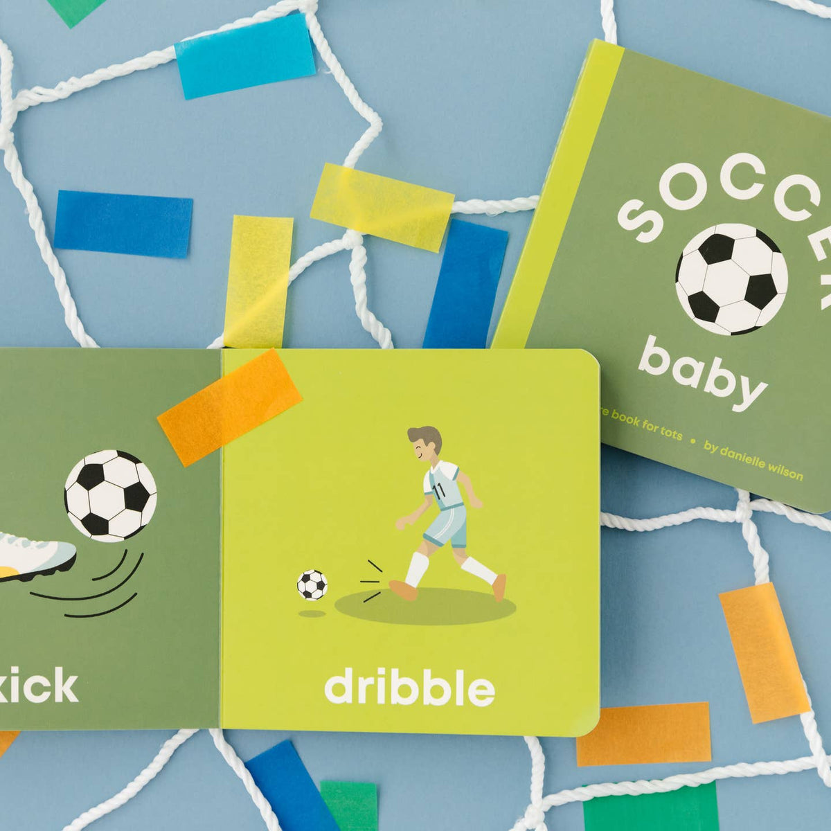 Children's educational book about soccer with colorful illustrations on a blue background.