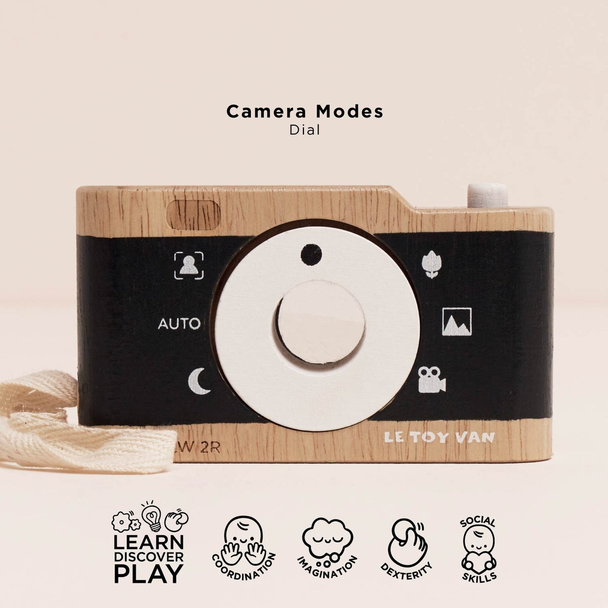 Wooden toy camera with black dial and 'Le Toy Van' branding on a beige background.