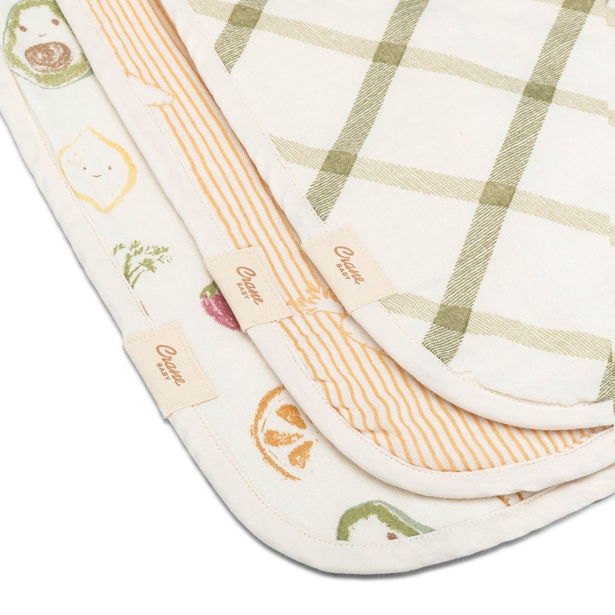 Set of baby burp cloths with different patterns on a white background