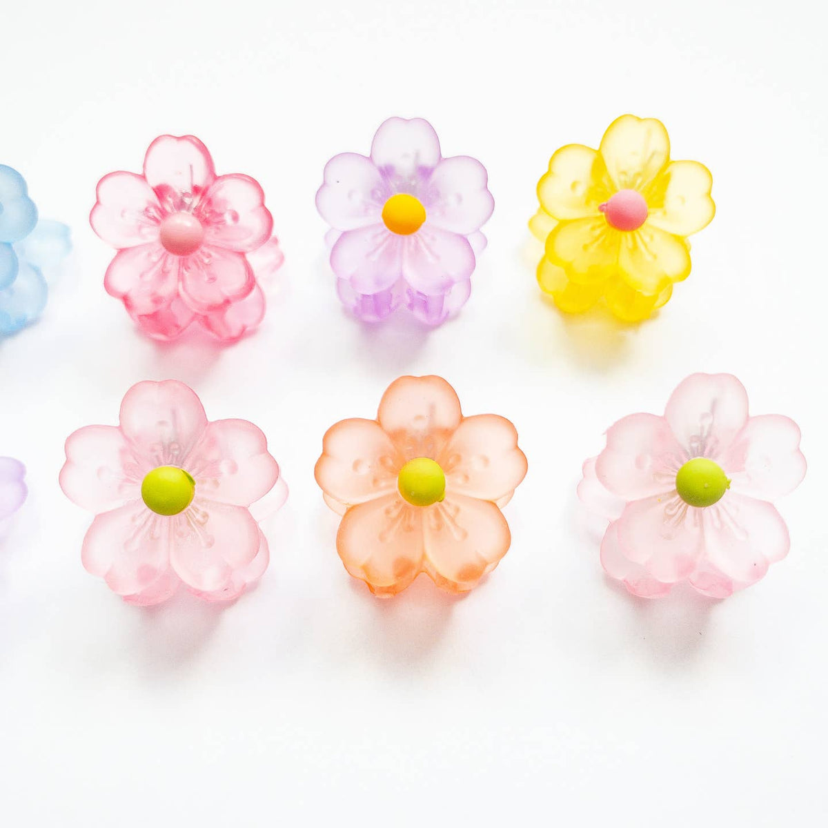 Colorful flower-shaped objects on a white background