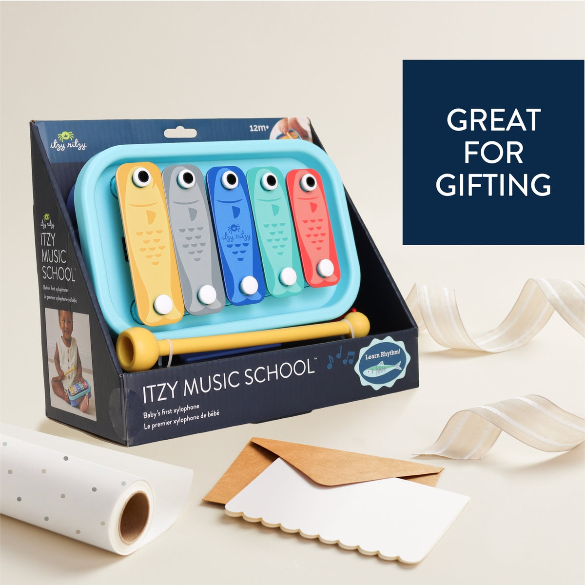 ITZY Music School toy packaging with colorful xylophone-like instrument on a light background.