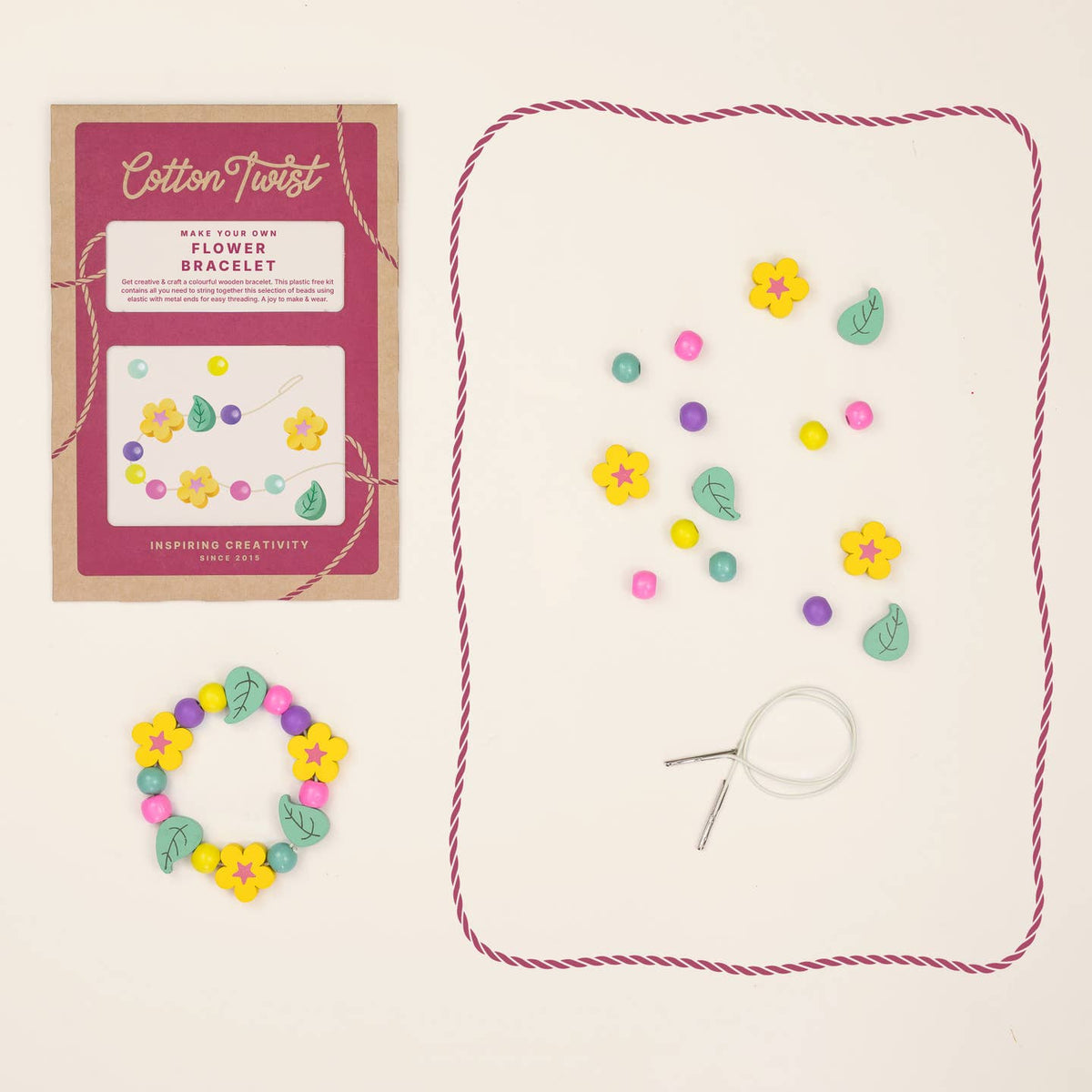 Flower bracelet-making kit with packaging, string, and flower-shaped beads on a beige background