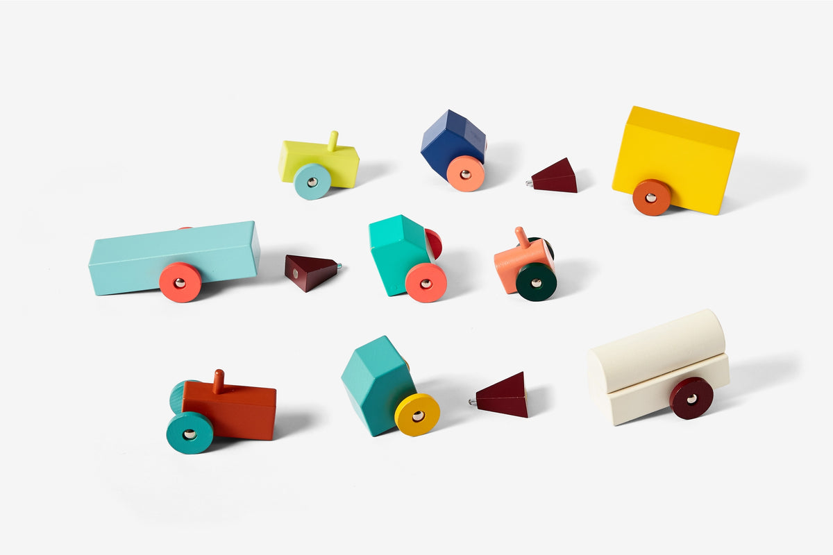 Colorful wooden toy cars on a white background