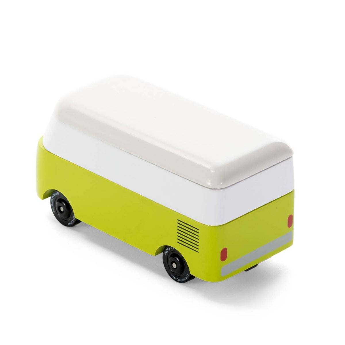 Small green and white toy van on a white background