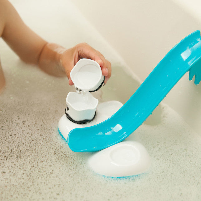 Blue bath toy with suction cups in a bathtub
