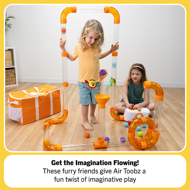 Children playing with an Air Toobz toy set on a wooden floor.