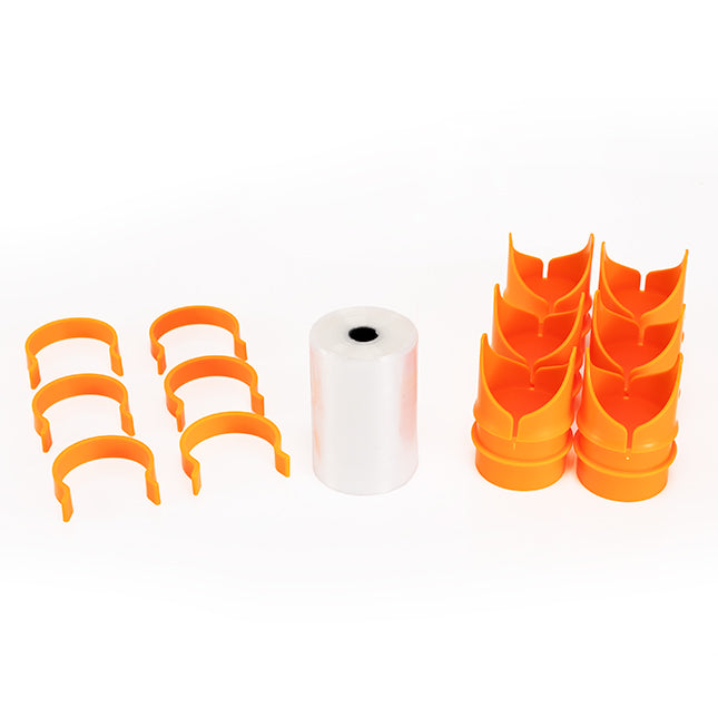 Set of orange plastic clips and a roll of white tape on a white background