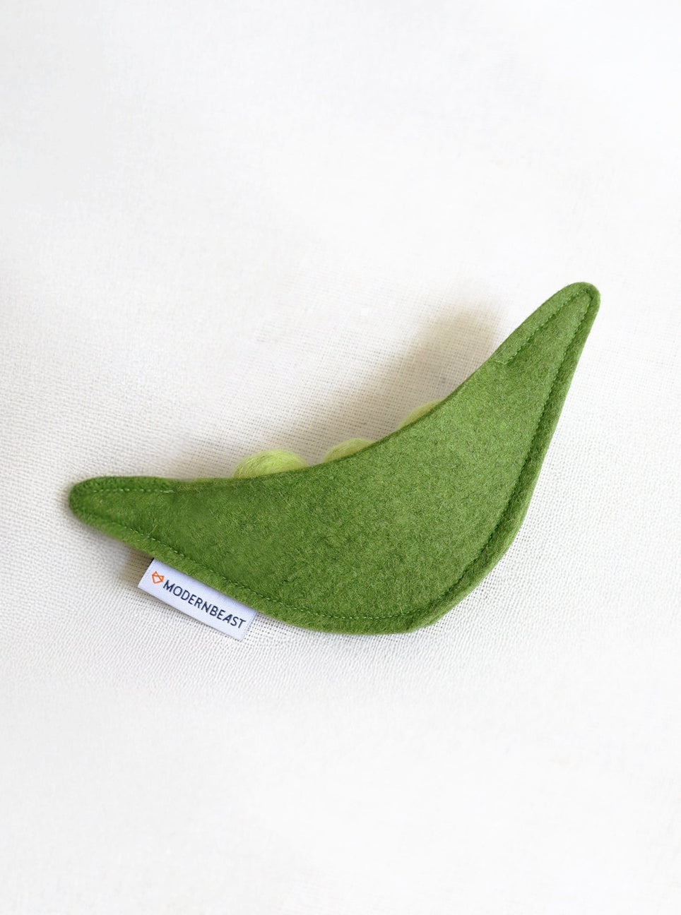 Green felt toy on a white background with 'ModernBeast' label.
