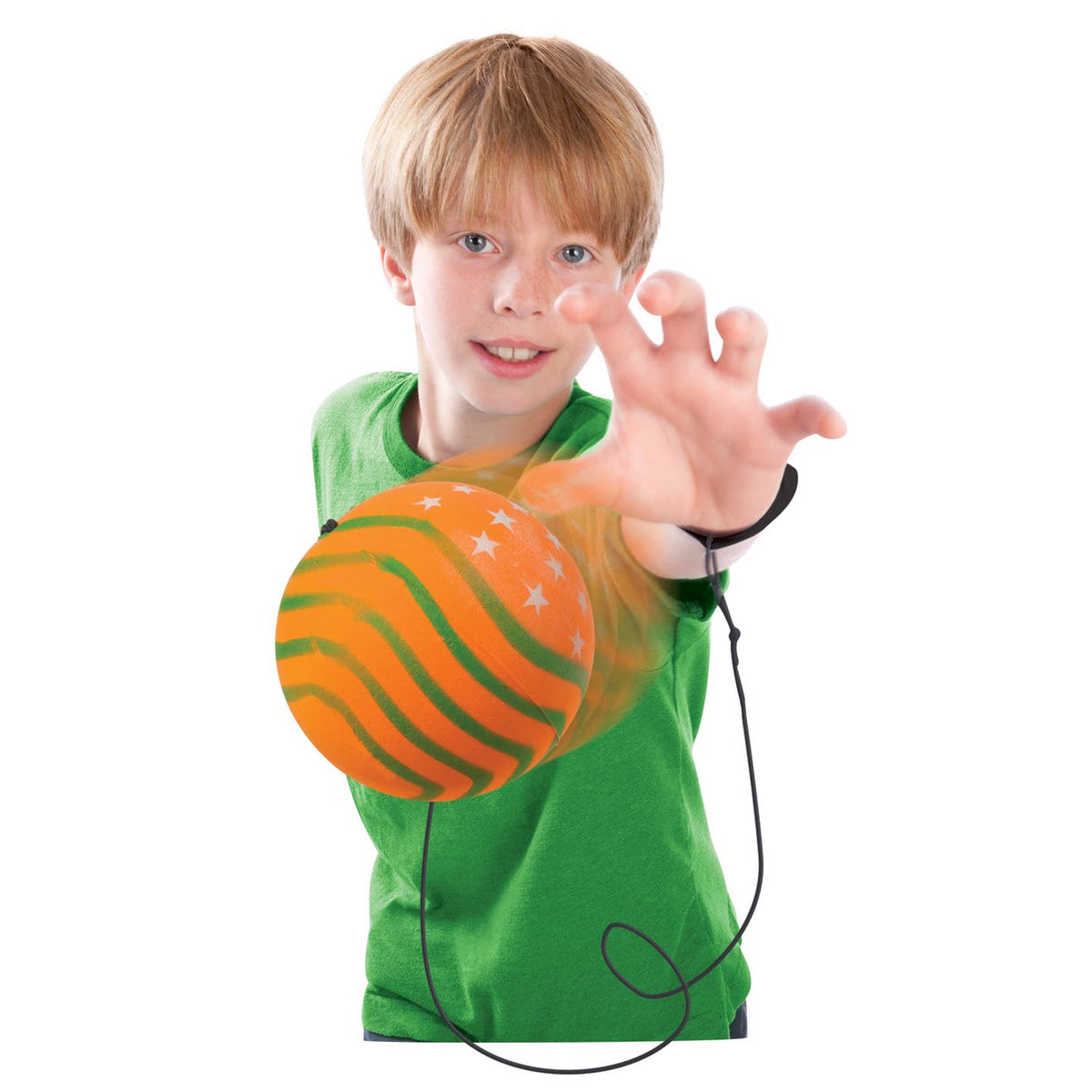 Child holding an orange ball with a black cord, wearing a green shirt on a white background