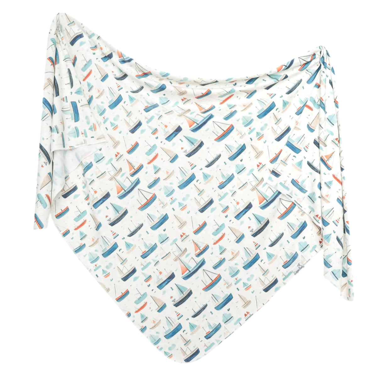 A white baby blanket or swaddle printed with a repeating pattern of colorful sailboats in shades of blue, orange, and gray, displayed against a solid white background.